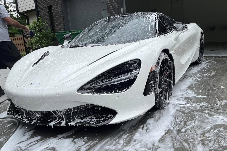 Automotive paint receiving a protective wax coating for lasting shine in Universal City, Texas