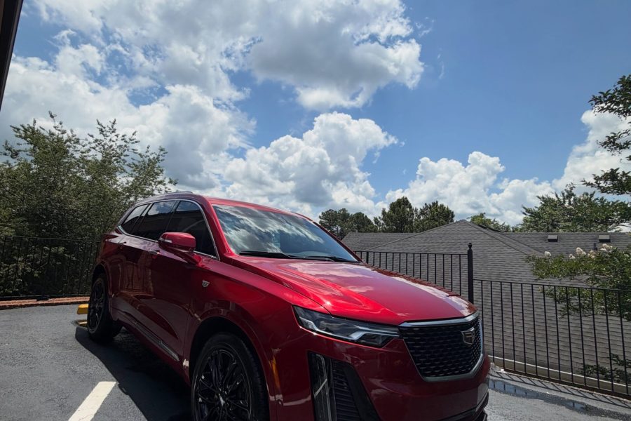 Car exterior receiving a thorough foam wash with detailed wheel and tire cleaning in Crystal, Minnesota