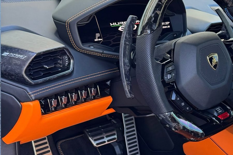 Vacuum nozzle removing dust from a vehicle’s dashboard seams in Woodbridge, Virginia
