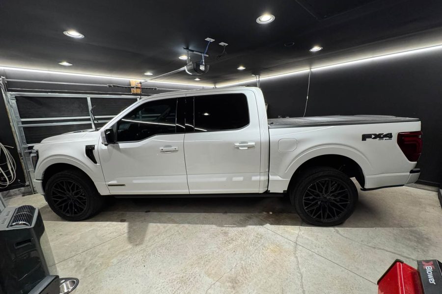 Thorough exterior hand wash cleaning a vehicle’s paint and wheels in Spring Hill, Florida