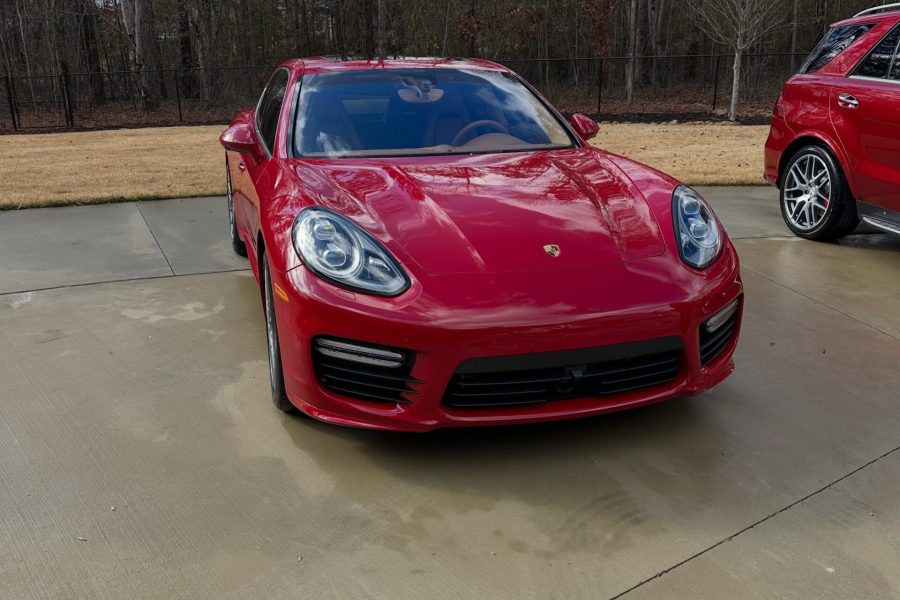 Car exterior receiving a careful hand wash with detailed wheel and tire cleaning in Winter Garden, Florida