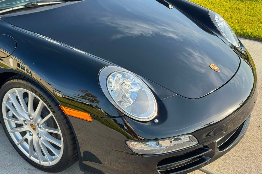 Exterior vehicle wash removing dirt from the paintwork and wheels in Lakeland, Florida