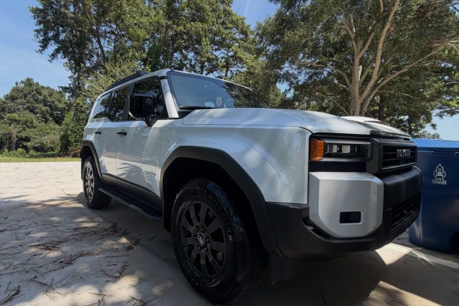 Car exterior receiving a thorough foam wash with detailed wheel and tire cleaning in Ocoee, Florida