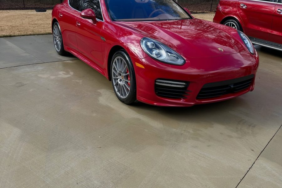 Car exterior receiving a thorough foam wash with detailed wheel and tire cleaning in Pinellas Park, Florida