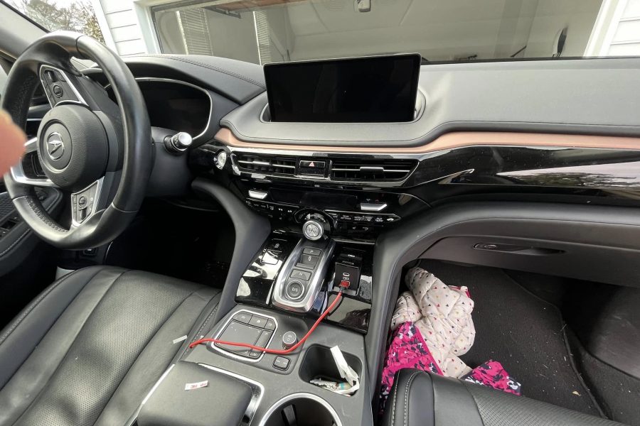 Cleaning a vehicle’s center console in Smyrna, Georgia