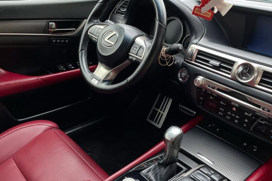 Detailed car interior vacuuming with dashboard and console care in Davenport, Iowa