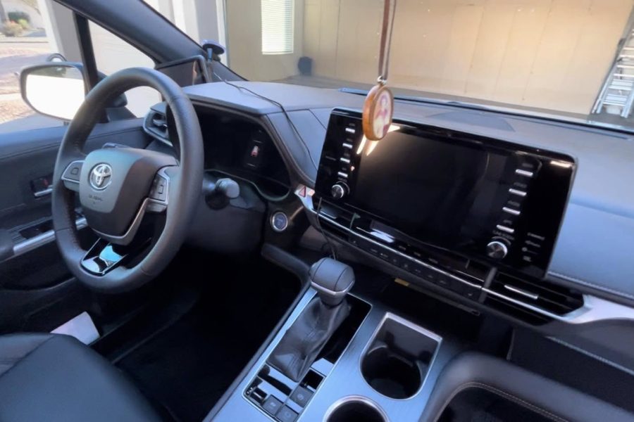 Upholstery extractor cleaning a vehicle’s rear bench seat in Patchogue, New York