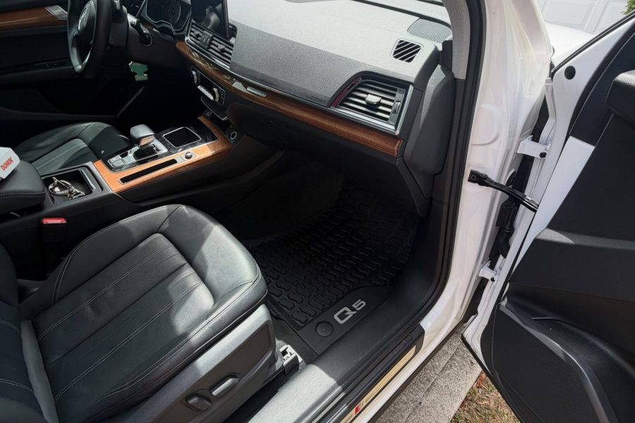 Vehicle cabin undergoing thorough vacuuming with dashboard and upholstery care in Dunedin, Florida