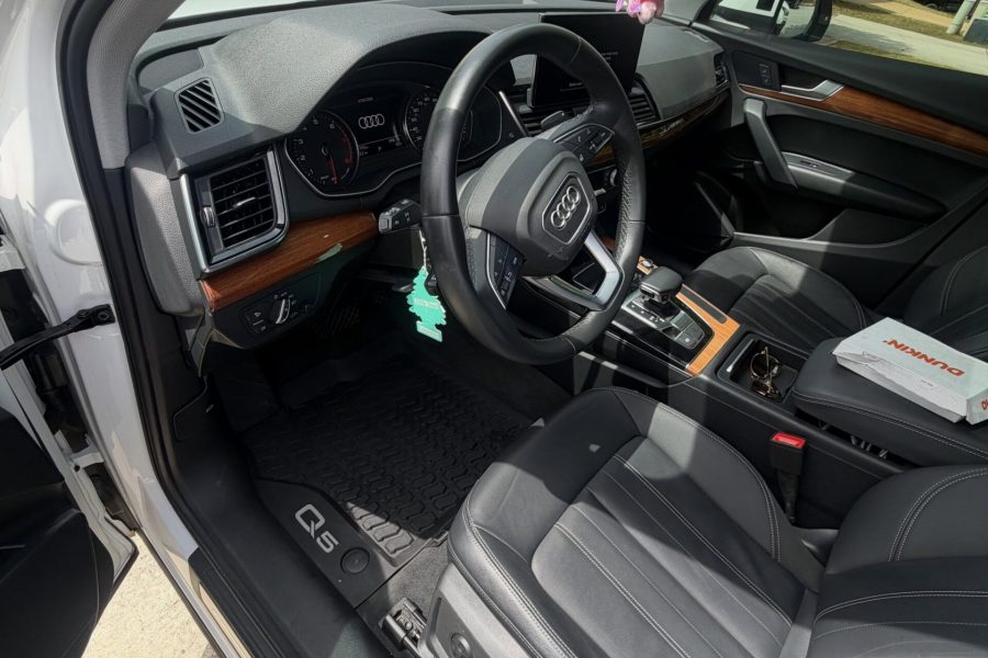 Vehicle seats, dashboard, and center console receiving thorough cleaning in Winter Garden, Florida